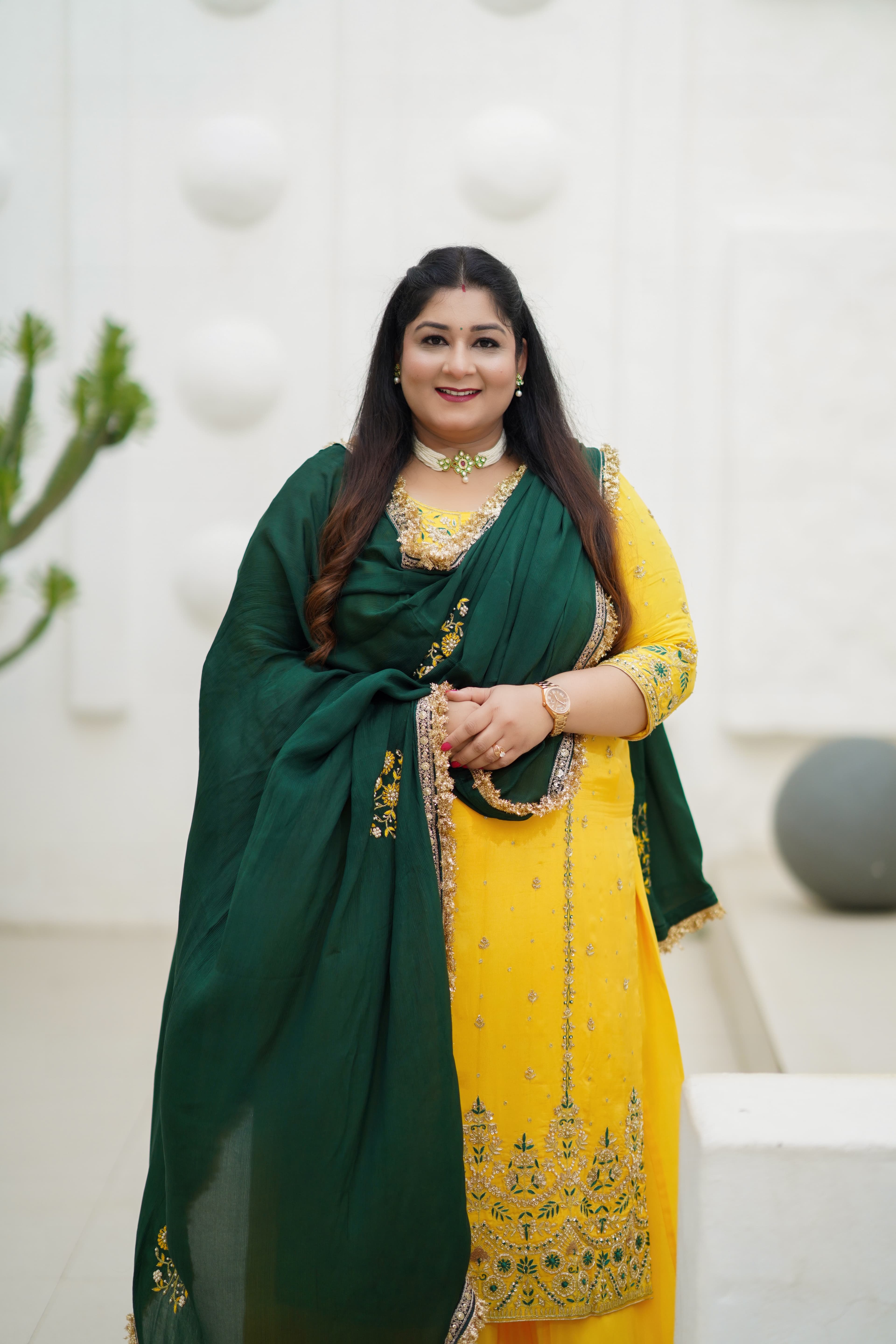 Komal Kalra in a softly lit consultation setting.