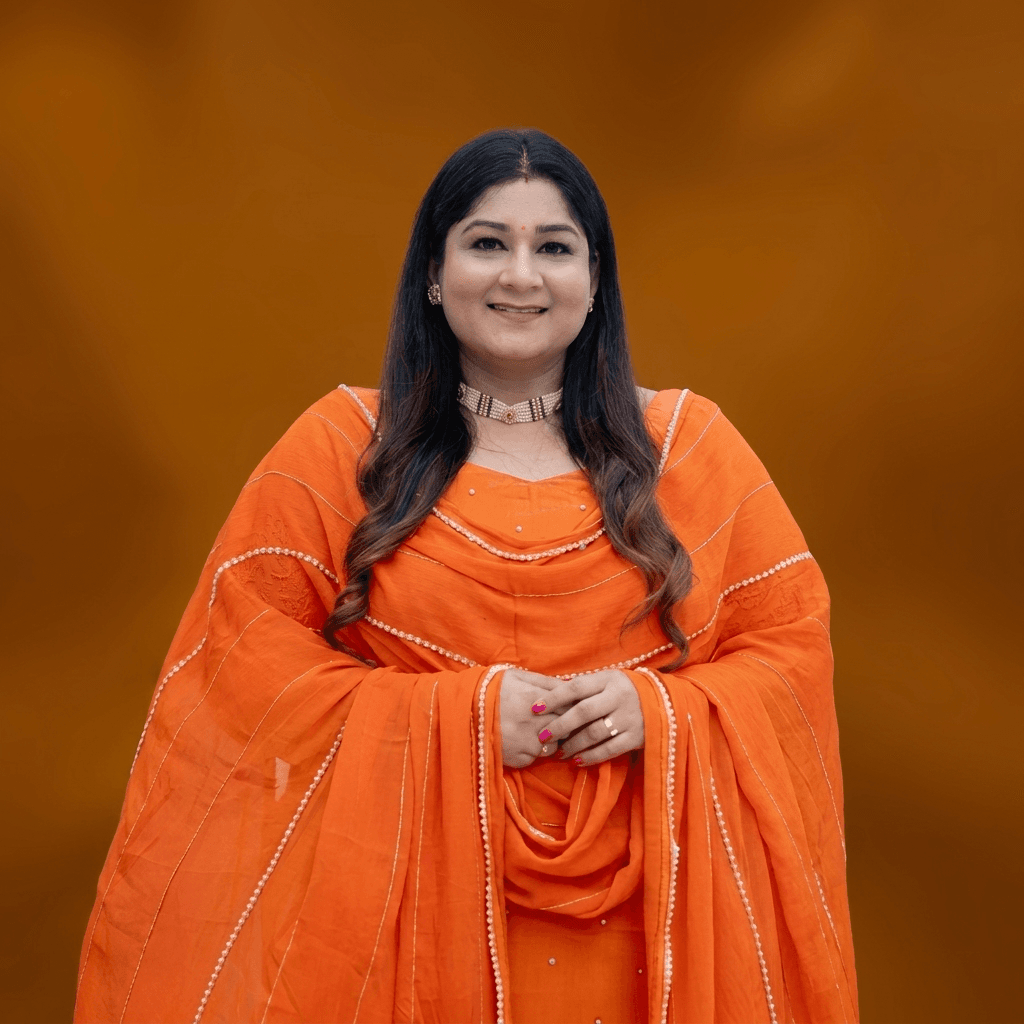 Komal Kalra in a warm, editorial portrait.